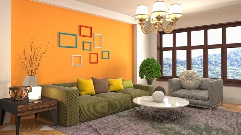 Bức tường màu cam được phối hợp hài hoà với ghế sofa màu xanh lá; cây xanh trong không gian tiếp thêm sinh khí trong phòng khách của người mệnh Hoả