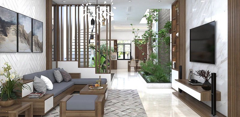 Phòng khách hiện đại với các món đồ nội thất cơ bản như sofa, bàn trà, kệ tivi kết hợp với chậu cây xanh trang trí làm không gian thêm sống động